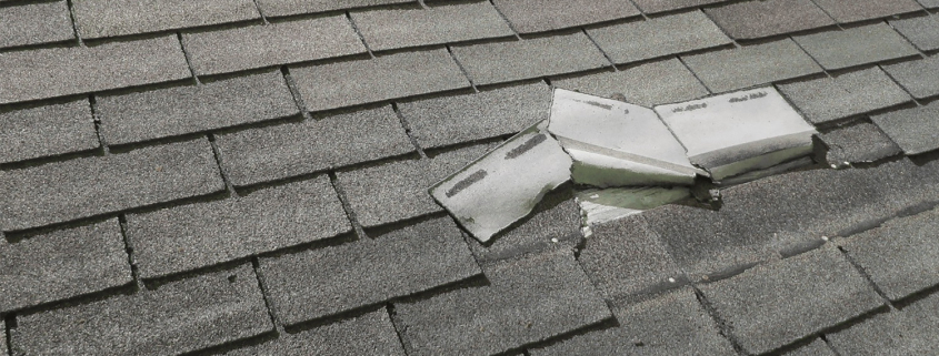 Illustration of a house with a damaged roof after a storm