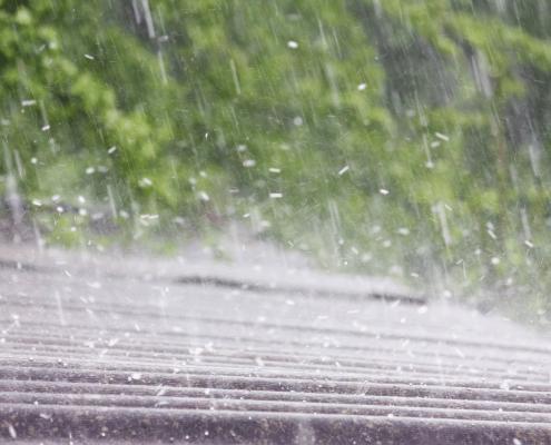 Illustration of a roof with missing shingles and water damage
