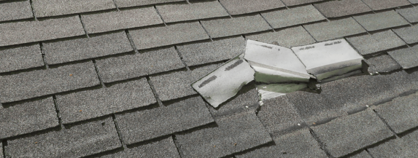 An image showing a damaged roof with missing shingles
