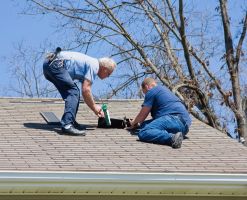 An image of a well maintained roof with new shingles illustrating preventive measures