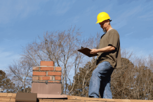 A professional roof inspector assessing a roof.