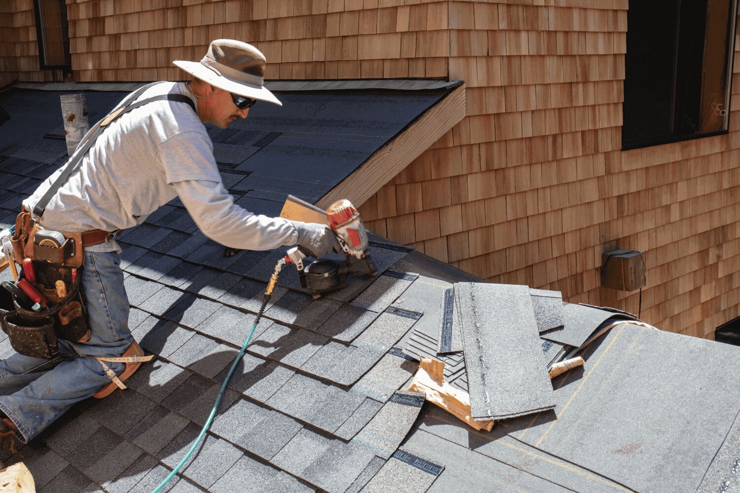 Factors influencing asphalt roof replacement costs, including material quality and roof size.