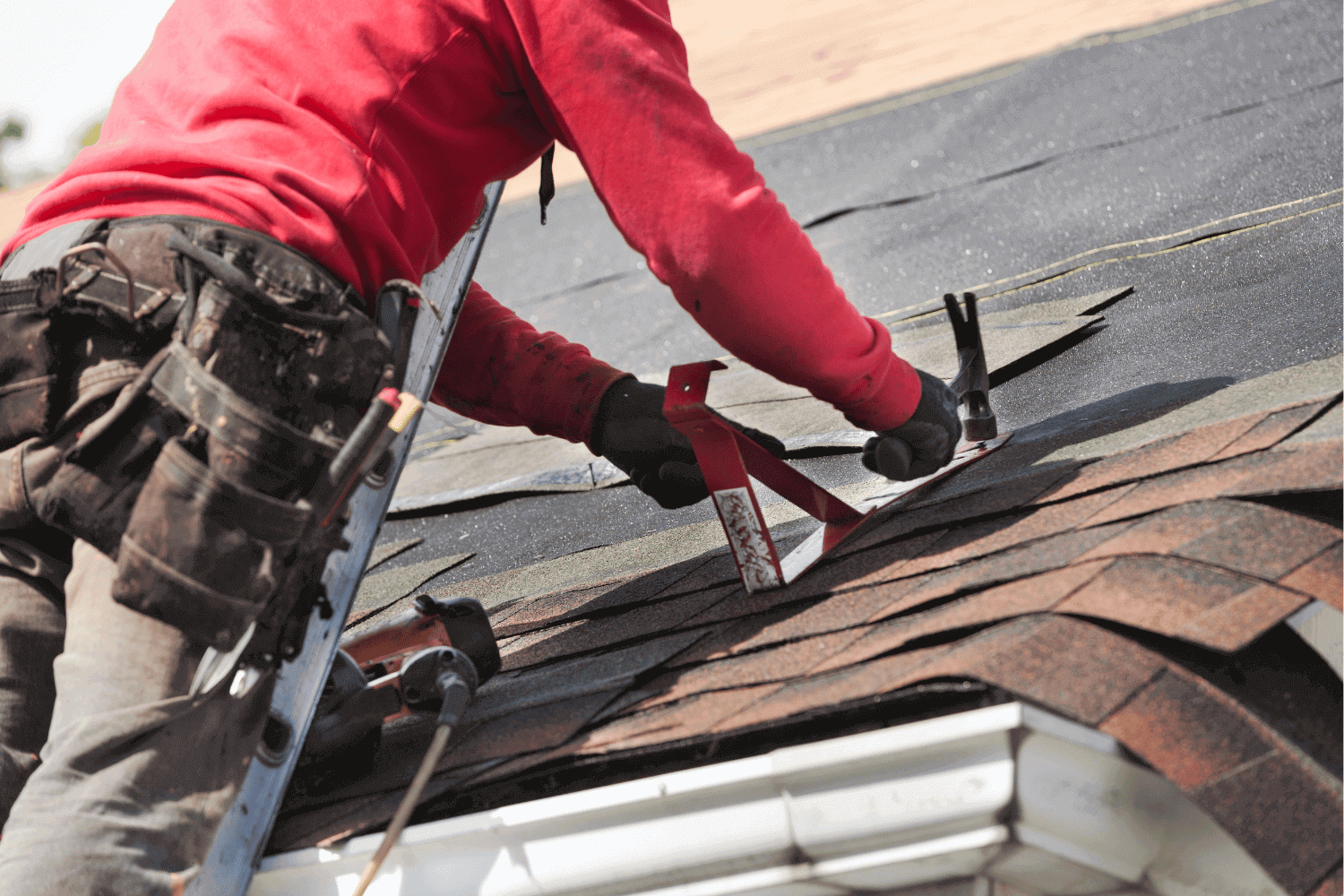 A roof with two layers of shingles, showcasing the existing shingles and the new layer.