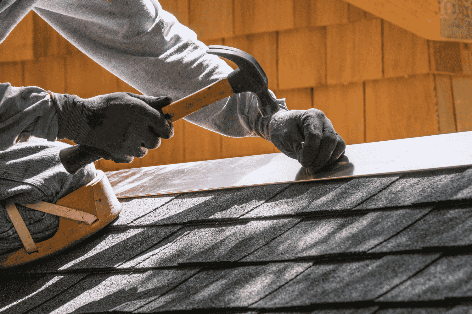 A homeowner inspecting their roof with a contractor, preparing for winter roofing. A homeowner inspecting their roof with a contractor, preparing for winter roofing.