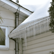 A diagram illustrating how gutter guards interact with ice dams and snow melt.