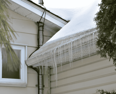 A diagram illustrating how gutter guards interact with ice dams and snow melt.