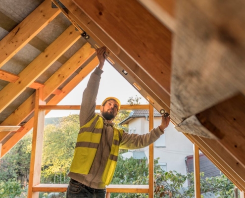 carpenter man working roof attic ventilation