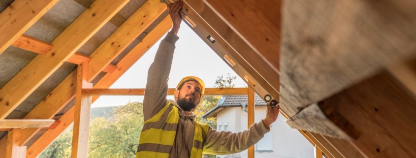 carpenter man working roof attic ventilation
